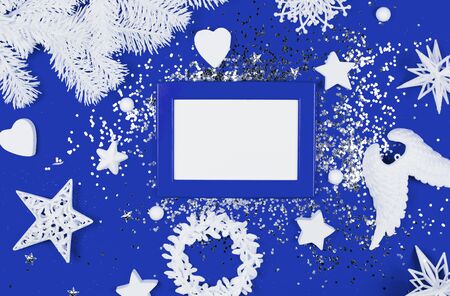 White christmas toys on blue background. Flat lay style.の写真素材