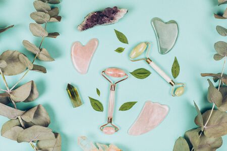 Facial massage kit. Face roller and gua sha massager made from natural stones.の写真素材