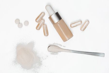 Different types of collagen. Powder, capsules, tablets and fluid.の写真素材