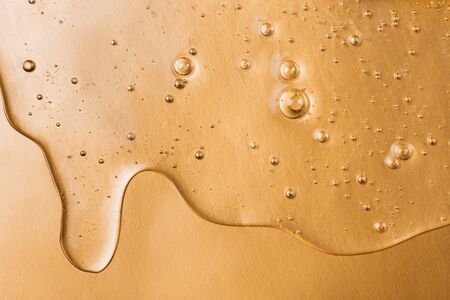 Hyaluronic acid gel. Textured background with oxygen bubbles on silver background.の写真素材