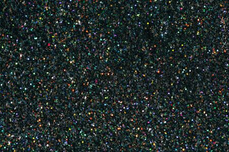 Texture made of black holographic sparkles. Creative party background.の写真素材