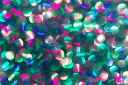 Blurred background with holographic sparkles and lights.の写真素材