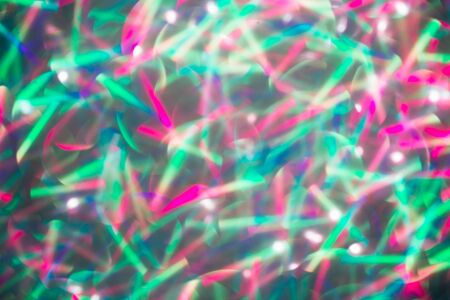 Blurred background with holographic sparkles and lights.の写真素材
