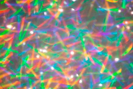 Blurred background with holographic sparkles and lights.の写真素材