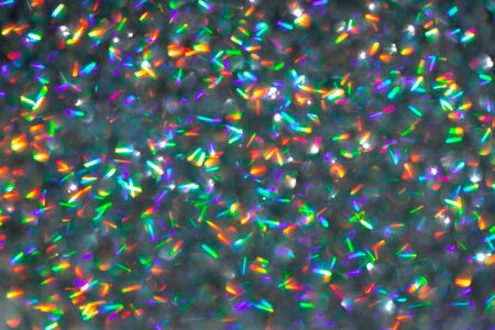 Blurred background with holographic sparkles and lights.の写真素材