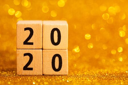 Horisontal numbers of 2020 on golden sparkling background. Place for text. Festive concept.の写真素材