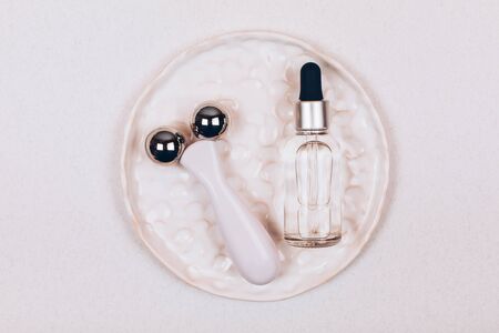 Facial massage kit. Face roller and gua sha massager made from natural stones.の写真素材