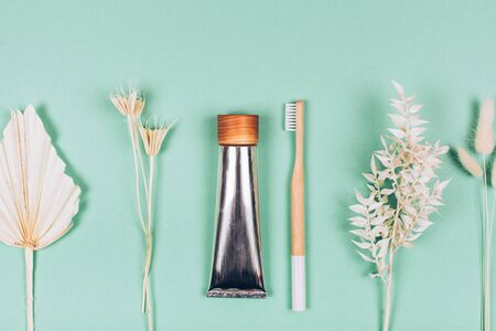 Zero waste self-care products. Bamboo toothbrush, toothpaste, tooth powder. Flat lay style.の写真素材