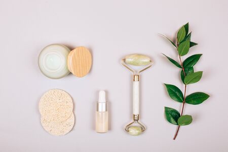 Zero waste self-care products. Cream, serum, hyaluronic acid, purifying silk cocoons and sponge. Flat lay style.の写真素材