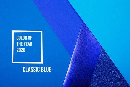 Divided in several parts blue paper background with metallic elemments. Inspired by color of the year 2020の写真素材