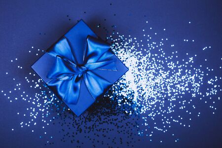 Blue present box with bow in monochrome trendy flat lay compositionの写真素材