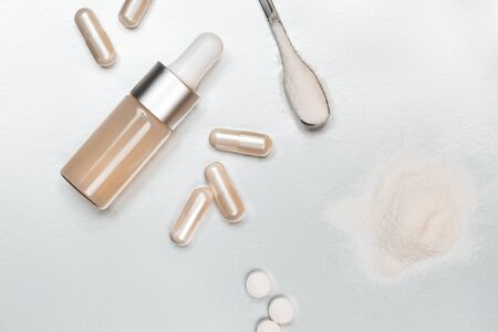 Different types of collagen. Powder, capsules, tablets and fluid.の写真素材