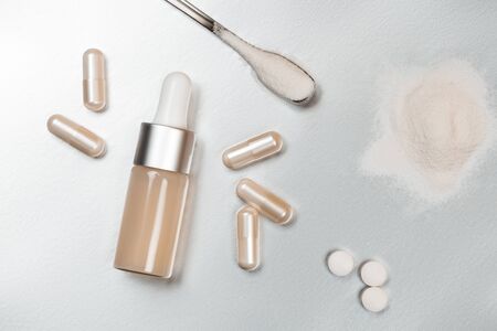 Different types of collagen. Powder, capsules, tablets and fluid.の写真素材