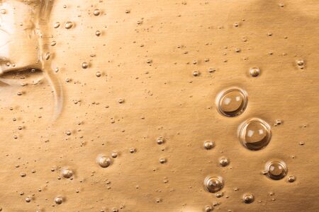 Hyaluronic acid gel. Textured background with oxygen bubbles on silver background.の写真素材
