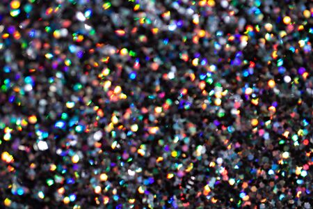 Blurred background with holographic sparkles and lights.の写真素材