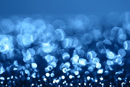 Blue sparkling abstract background. Festive concept. Color of the year 2020 concept.の写真素材