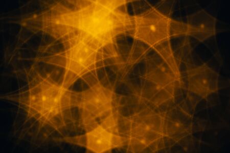 Splash of golden stars on black background.の写真素材