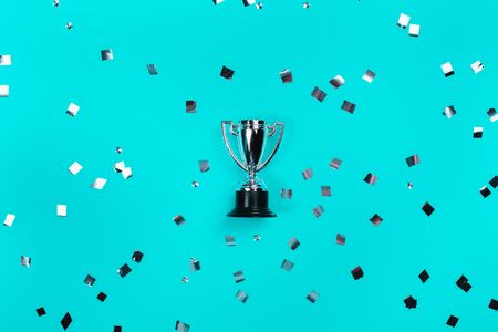 Champion cup on blue background, Flat lay style. Open composition.の写真素材