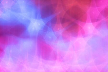 Splash of blue and pink sparkles on black background.の写真素材