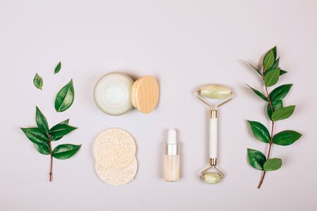 Zero waste self-care products. Cream, serum, hyaluronic acid, purifying silk cocoons and sponge. Flat lay style.の写真素材