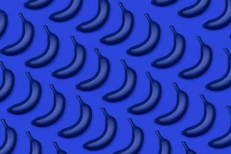 Group of blue bananas as a pattern. Flat lay style. Monochrome trendy photo ispired by color of the year 2020の写真素材