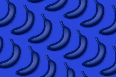 Group of blue bananas as a pattern. Flat lay style. Monochrome trendy photo ispired by color of the year 2020の写真素材