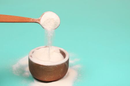 Collagen or protein in powder on teal background.の写真素材