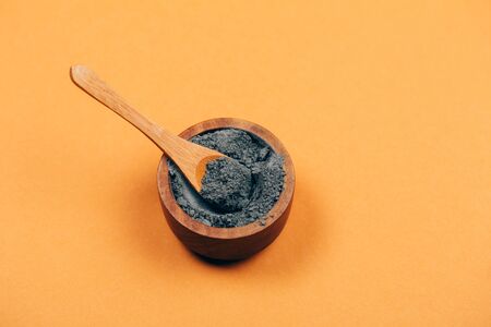 Home skin care. Grey clay with wooden spoon. Modern apothecary. Flat lay style.の写真素材
