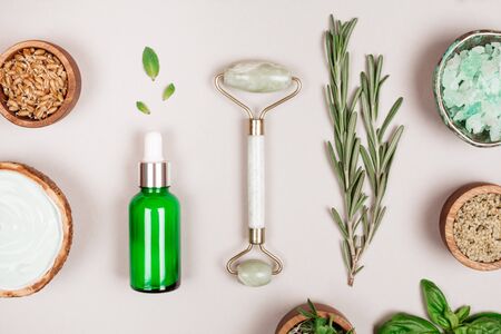 Modern cosmetics accessoires and ingredients on grey background. Flat lay style.の写真素材
