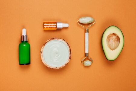 Modern accessories and herbal cosmetics for natural face care. Flat lay style.の写真素材