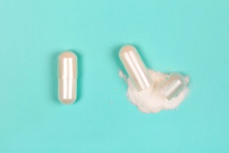 Capsule of collagen with beuty powder inside. Flat lay style.の写真素材