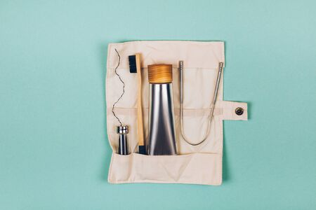 Zero waste self-care products for travel. Bamboo toothbrush, toothpaste, , tongue cleaning and flax. Flat lay style.の写真素材