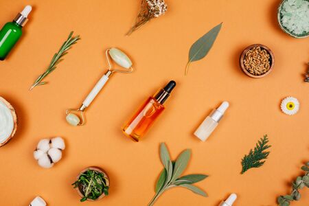 Modern accessories and herbal cosmetics for natural face care. Flat lay style.の写真素材
