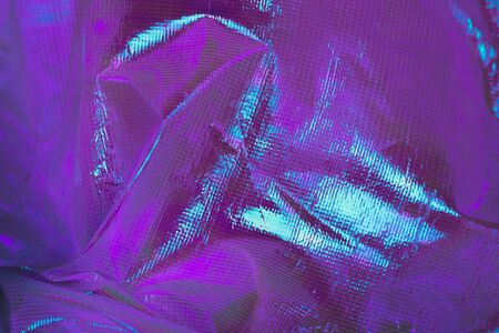 Bright holographic foil background. Multicolor trendy backdrop.の写真素材
