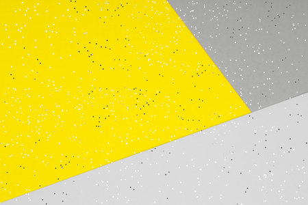Paper background in two trendy colors - yellow and gray. Demonstrating colors of 2021 yearの写真素材