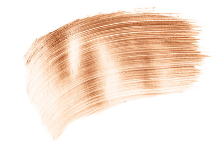 Beautiful textured golden strokes isolated on white background. Demonstrating color of the year 2024.の写真素材
