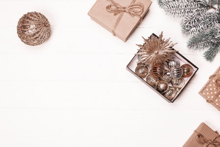 Festive decorations and gifts arranged on a wooden table for the holiday seasonの写真素材