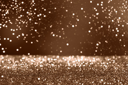 Elegant sparkling glitter bokeh background in brown tones for celebrations