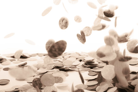 Falling confetti creating a festive and celebratory atmosphere in sepia tonesの写真素材