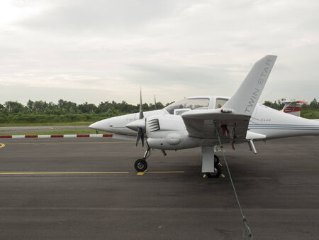 Bangkok, Thailand - Aug 5, 2014 : Small training aircraft on the airfield with sunset