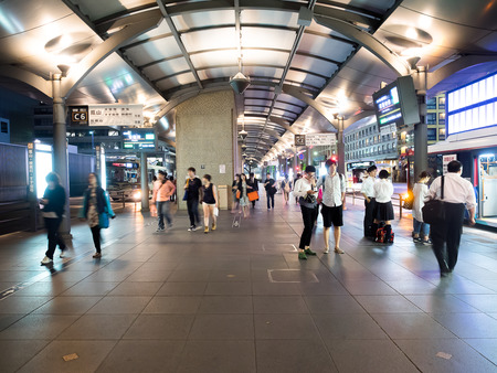KYOTO JAPAN - June 27, 2014: Unidentified people queue at Kyoto station bus terminal at night. Kyoto has a population for 1.5 million and nicknamed as the City of Ten Thousand Shrines.のeditorial素材