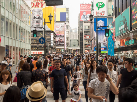 OSAKA, JAPAN - JUNE 29, 2014 : Unidentified people shop at Shinsaibashi Shopping arcade. Shinsaibashi is located next to famous entertainment area Dotonbori downtown Osaka.のeditorial素材
