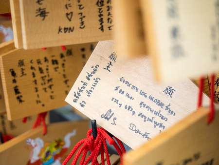 Kyoto, Japan - June 28, 2014 :  Horse wooden prayer tablets at Kiyomizu dera Kyoto (The Horse year) with thai hade writing. Pray for happieness good life healthy peace luck by write praying word in wooden.のeditorial素材
