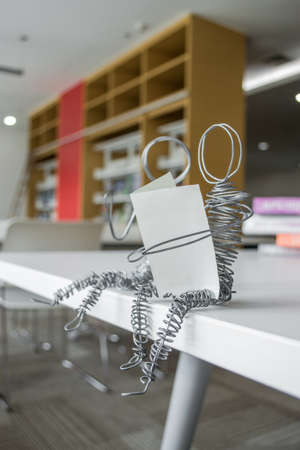 Wire boy reading in libraryの写真素材