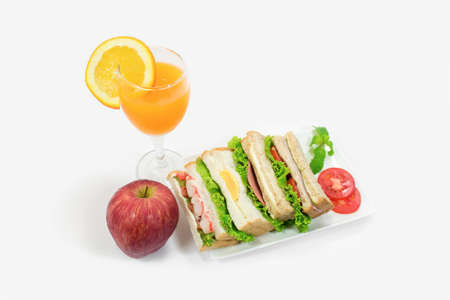 sandwich set with apple and orange juiceの写真素材
