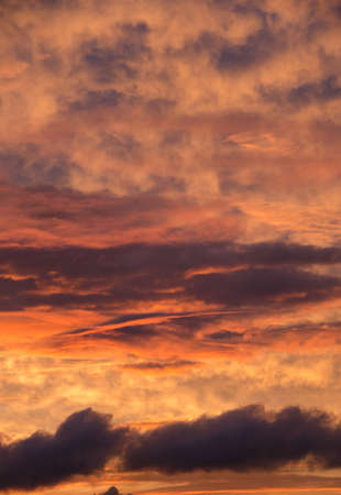 saturated colors colorful sunset . Summers are warm and beautiful sunset . Clouds filled with different colors of the rainbow . the sky as if drawn by an artist's brushの写真素材