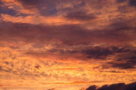 saturated colors colorful sunset . Summers are warm and beautiful sunset . Clouds filled with different colors of the rainbow . the sky as if drawn by an artist's brushの写真素材