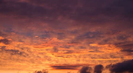 saturated colors colorful sunset . Summers are warm and beautiful sunset . Clouds filled with different colors of the rainbow . the sky as if drawn by an artist's brushの写真素材