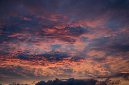 saturated colors colorful sunset . Summers are warm and beautiful sunset . Clouds filled with different colors of the rainbow . the sky as if drawn by an artist's brushの写真素材