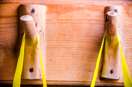 washcloths hanging on wooden hooks. Sponge for washing on a hangerの写真素材
